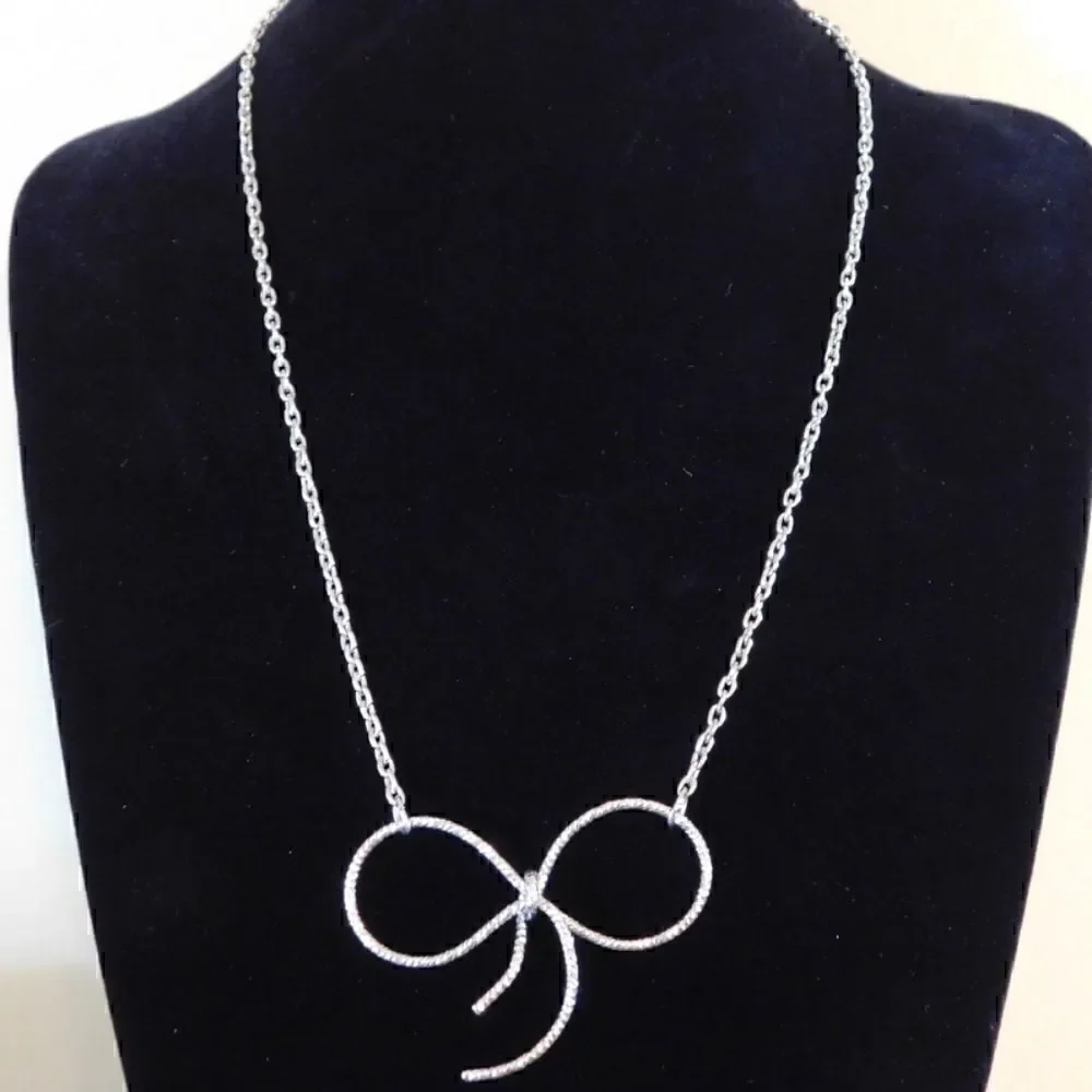 Silver Toned Bow Necklace with Clear Stones